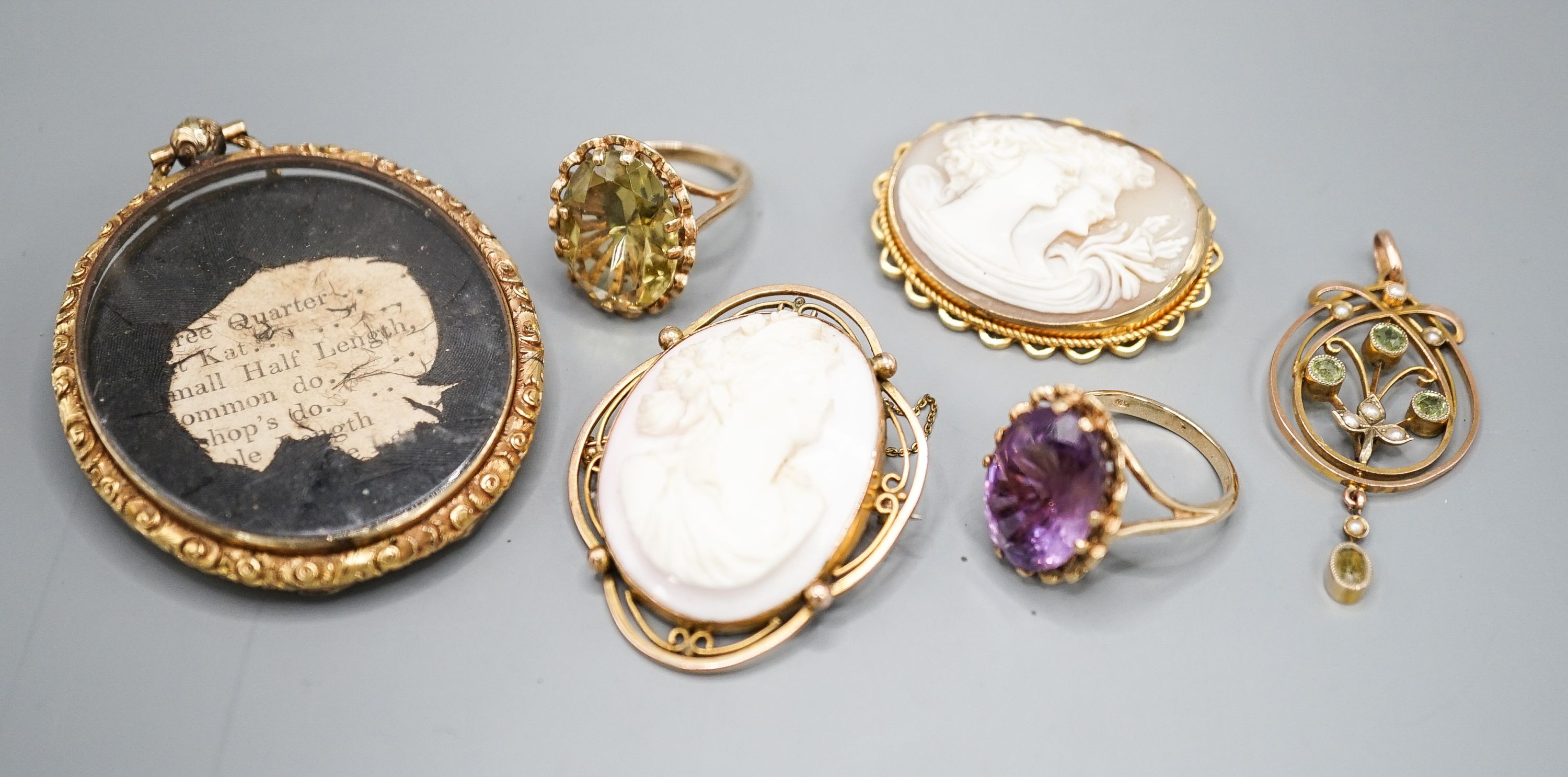 Two modern 9ct gold and gem set rings, a 9ct and gem set pendant, two 9ct mounted cameo shell brooches, gross weight 36.5 grams and a Victorian oval pendant frame, 55mm.